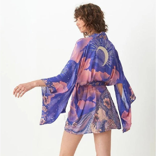 dressed in a black-purple kimono with moon-shaped white accents